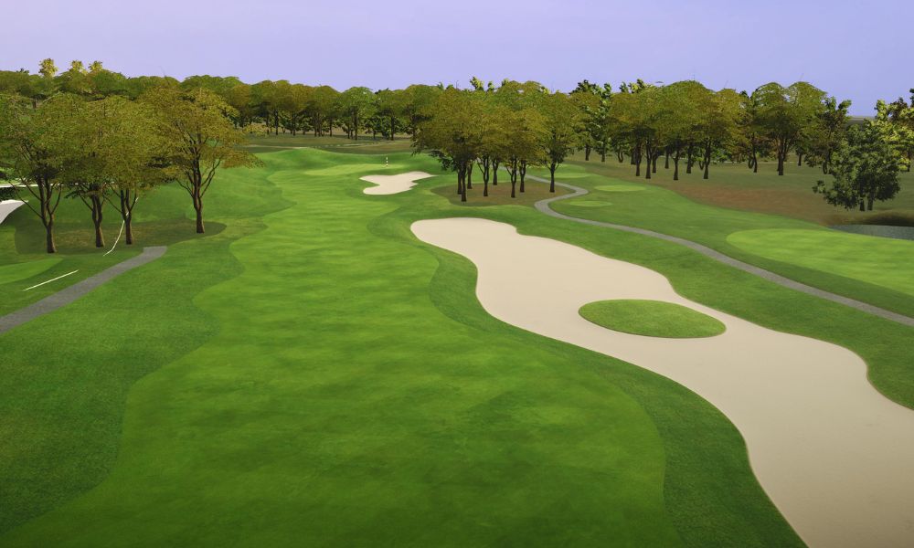 Golf course with green grass, sand bunkers, and trees under a clear blue sky.