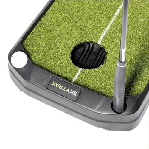 Close up view of the top of the SKYTRAK return mat showing ball and club holder.