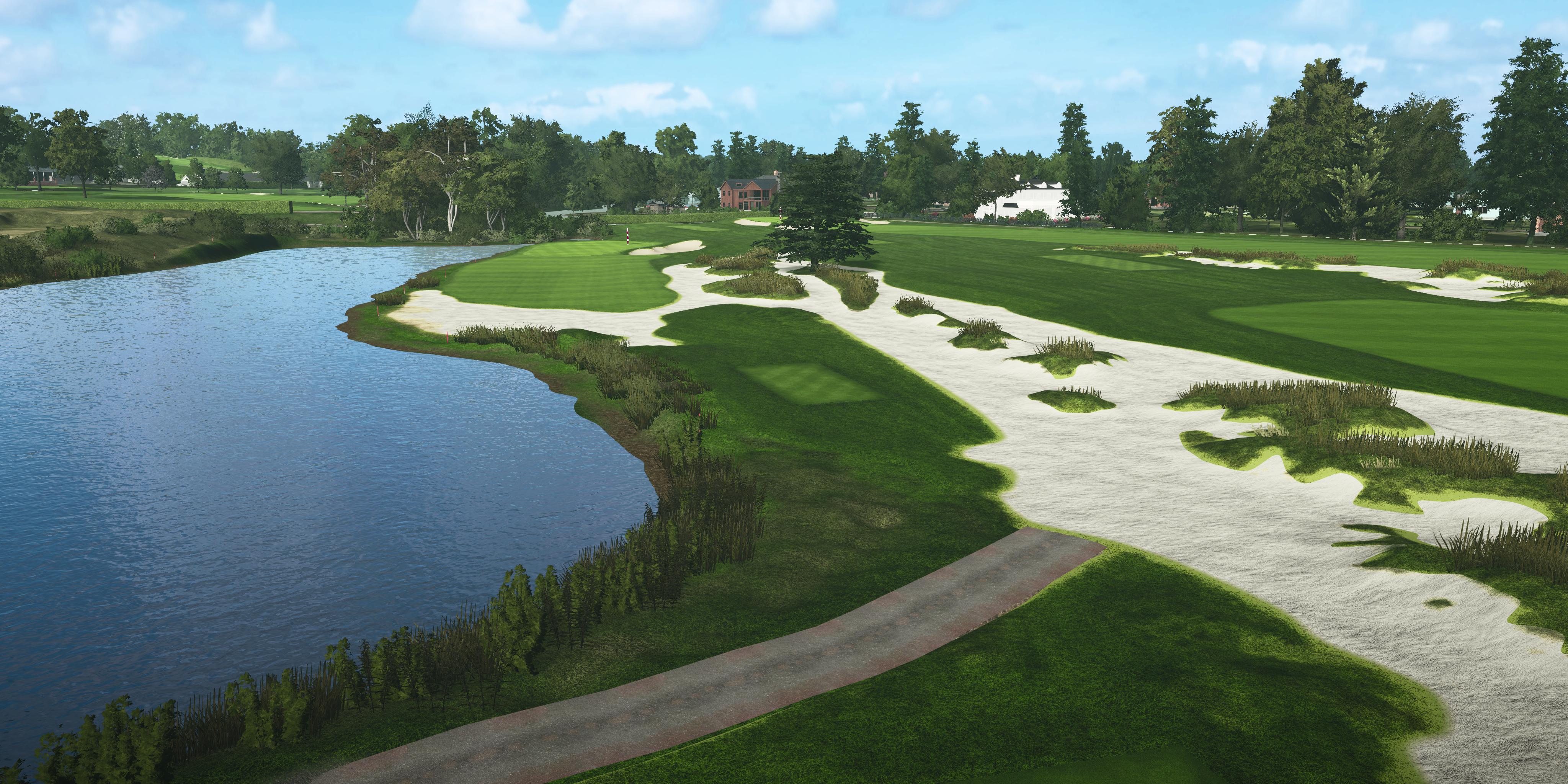 Golf course with a lake and sand bunkers on a clear day