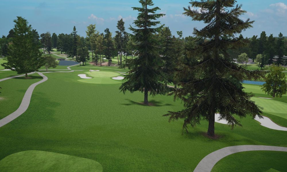 Golf course with green grass, trees, and pathways under a clear blue sky.