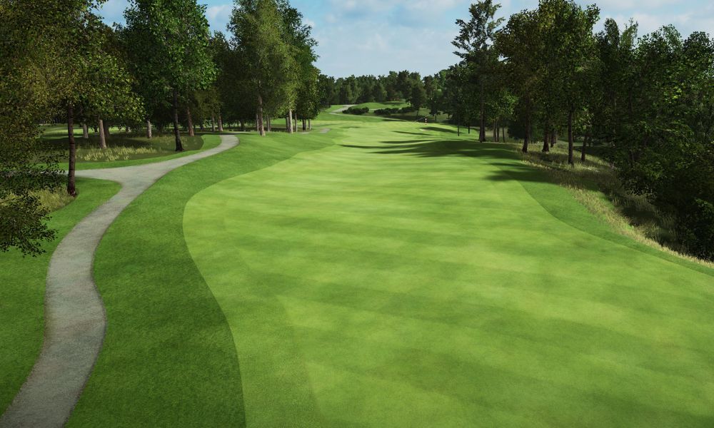 Golf course with green grass and trees under a clear sky