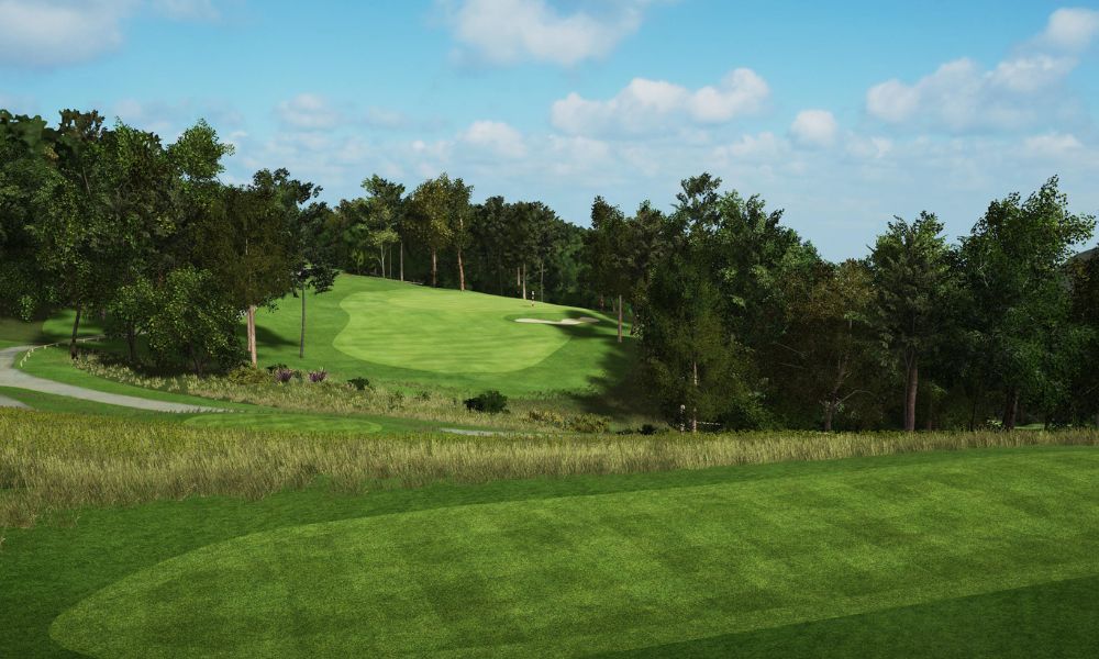 Golf course with green fairway and trees under a blue sky