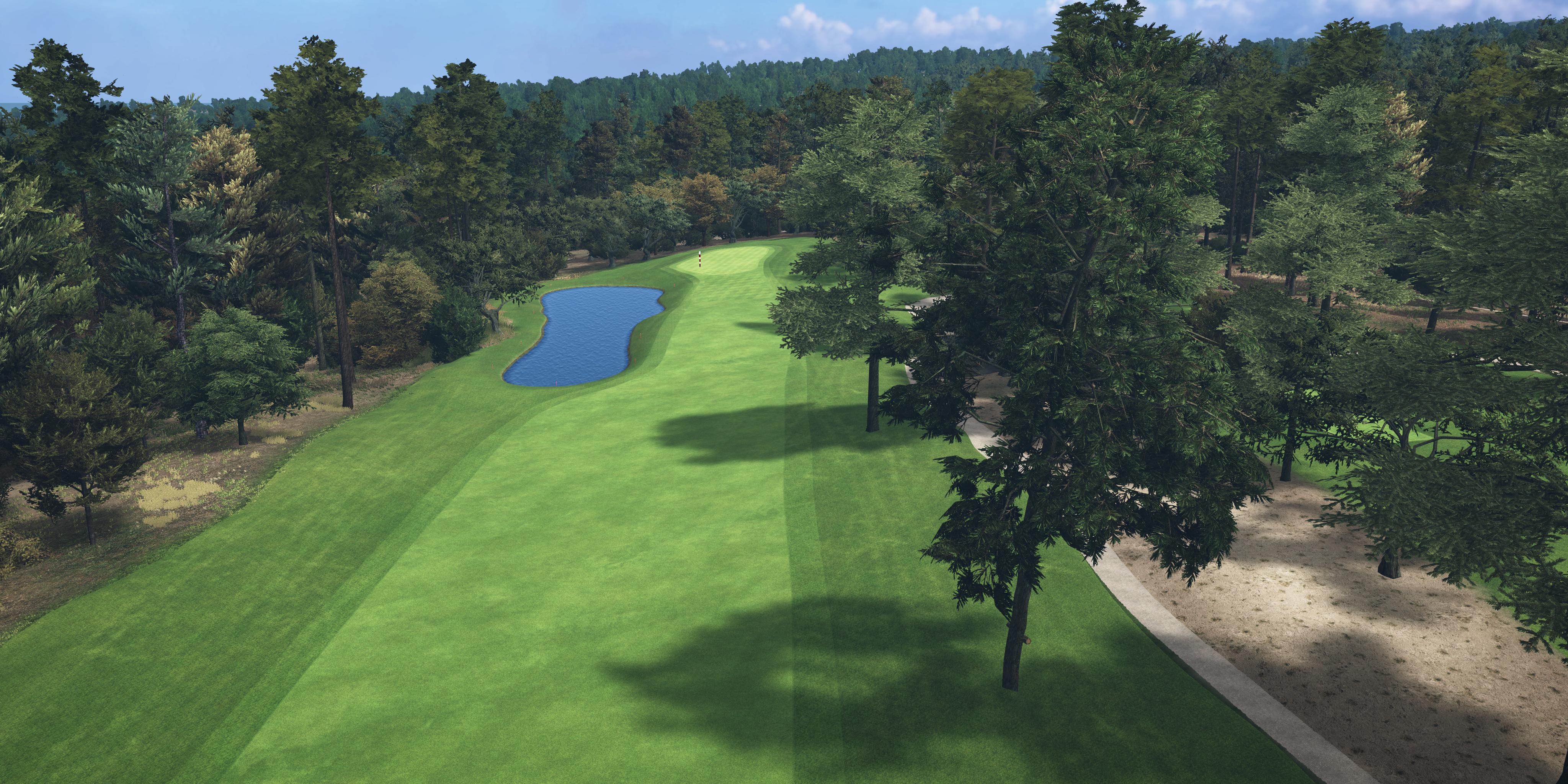 Golf course with green grass, trees, and a small pond.